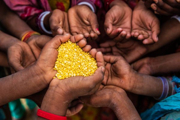 Poor African children keeping their hands up - asking for food. Many African children suffer from poverty - 20% of Africa’s children will die before the age of five.  Every day 30,000 children die from a combination of disease- infested water and malnutrition,